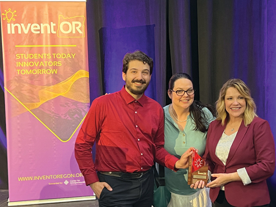 Niles Water, marketing coach Jennifer Lee, and Melanie McClure with their award.